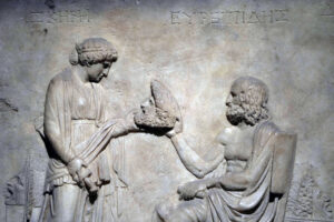 Photo of Euripides handing with a mask.